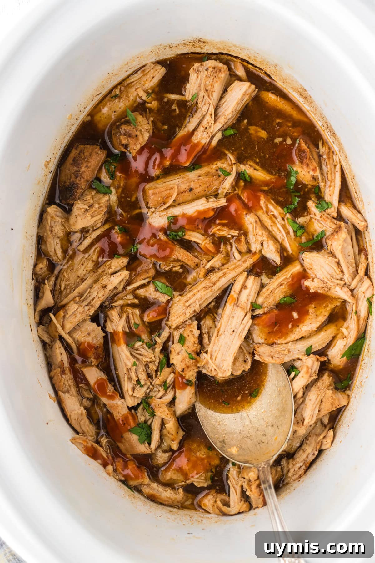 Slow-Cooker Dr Pepper Pulled Pork Recipe 2 A slow cooker filled with Dr Pepper pulled pork.