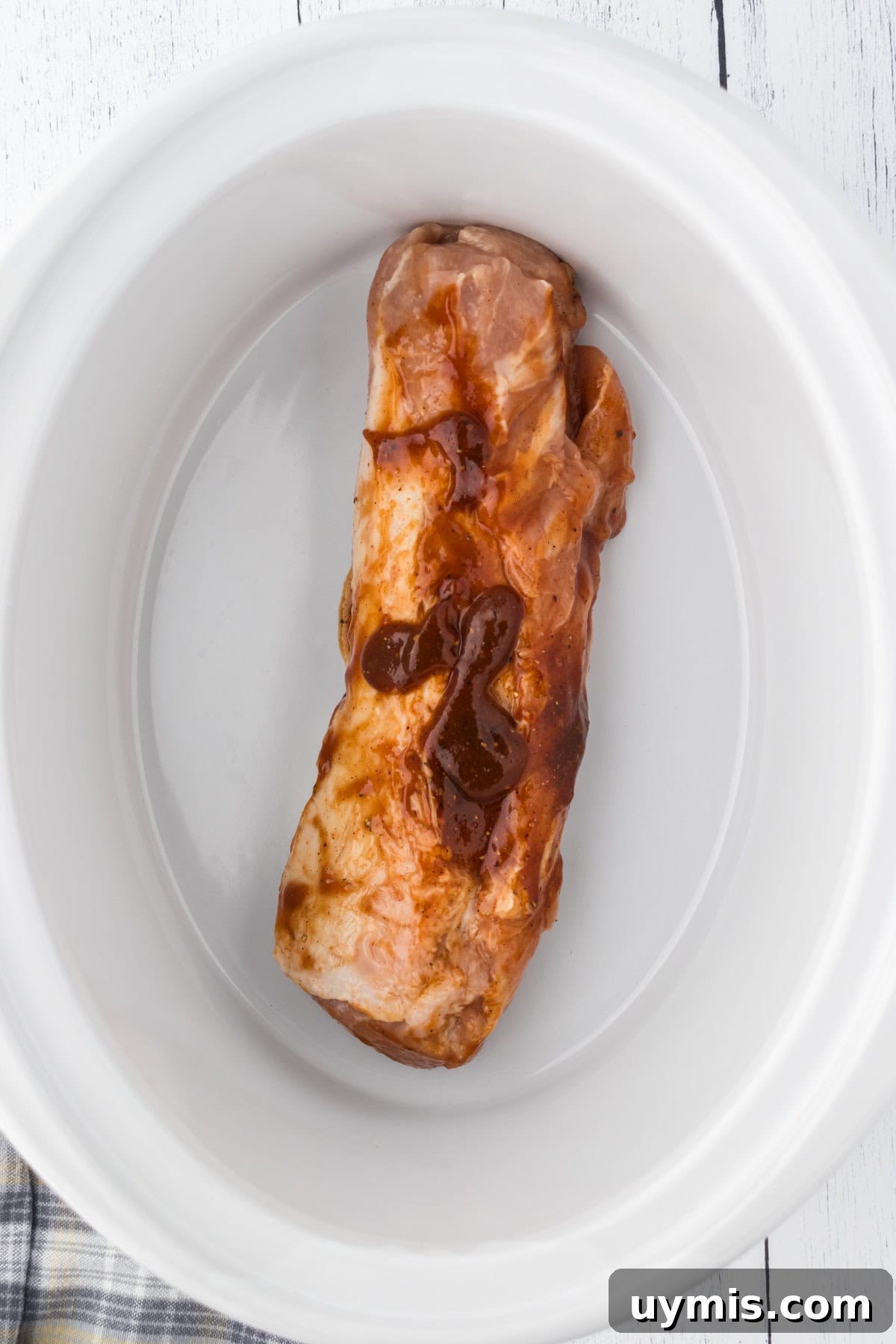 Slow-Cooker Dr Pepper Pulled Pork Recipe 5 Adding the pork tenderloin to the slow cooker.