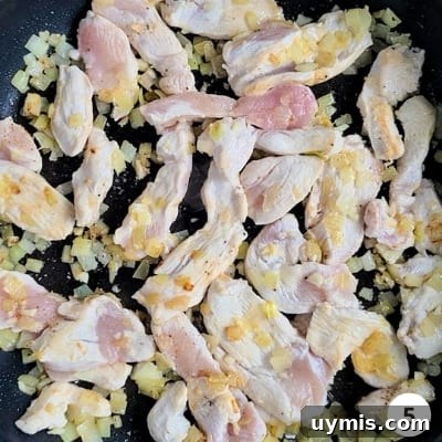 Light Chicken and Broccoli Pasta Recipe 8 Chicken strips cooking on high heat with onions and garlic