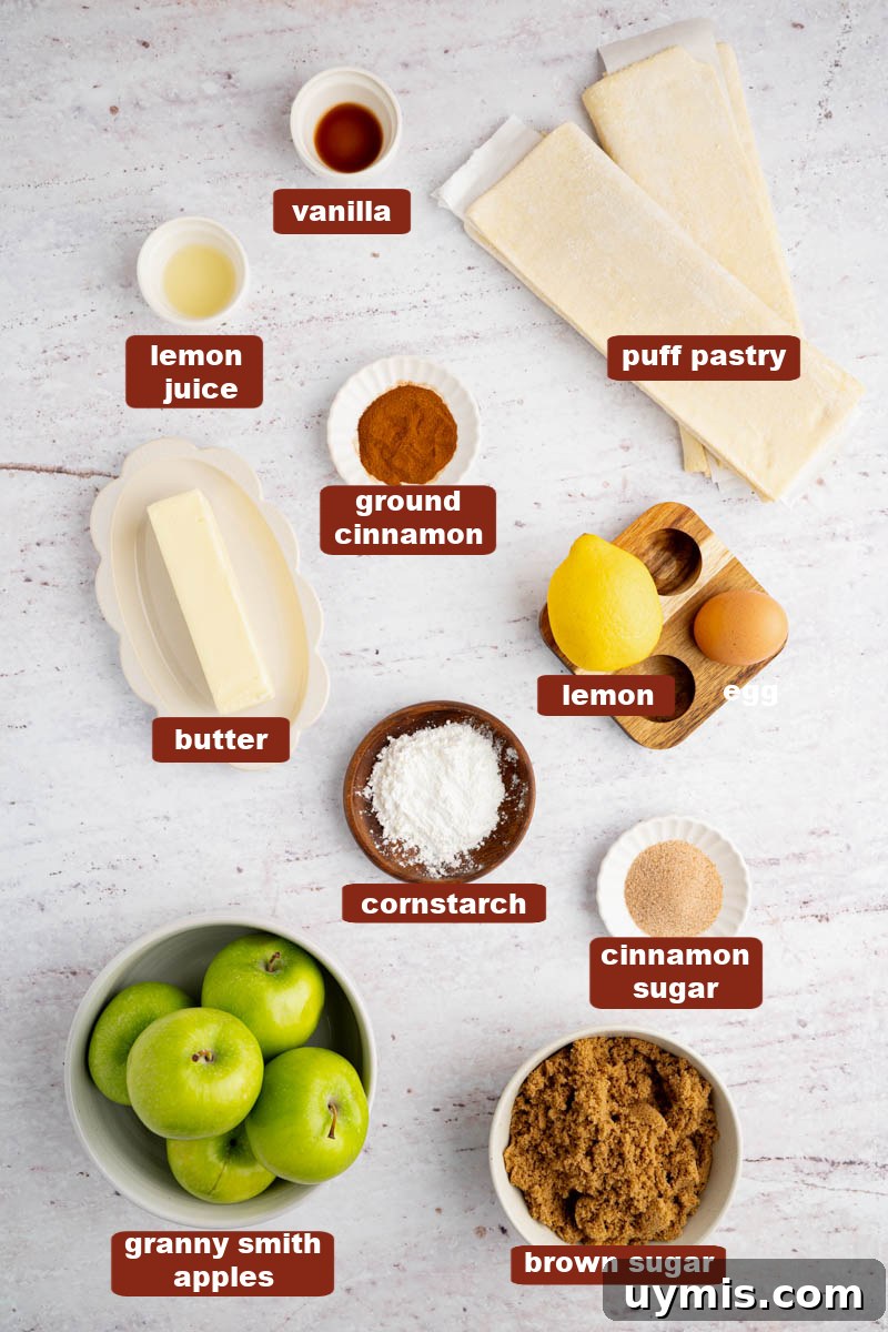 Warm Apple Hand Pies with Cinnamon and Flaky Crust 2 All of the ingredients for apple hand pies in bowls on a white countertop.