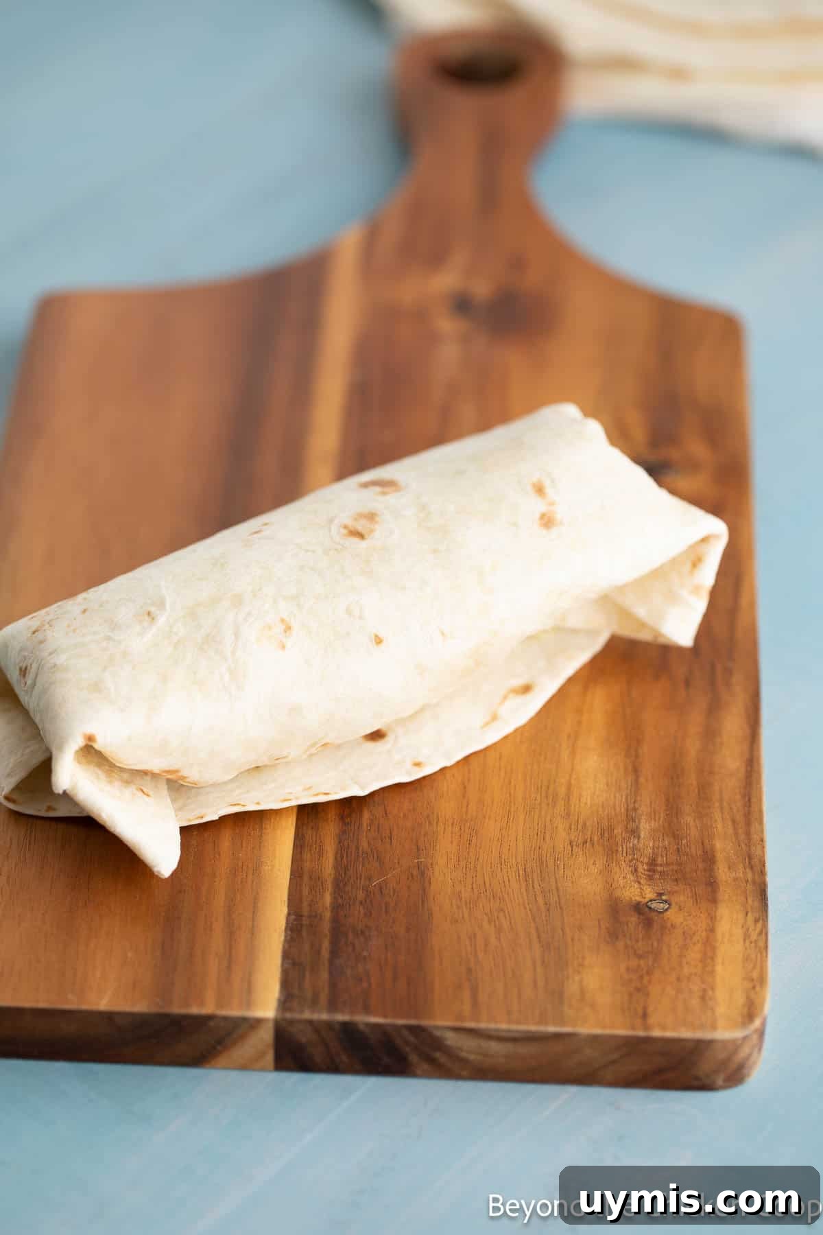 Chicken Caesar Wrap with Creamy Dressing 6 A wrapped Caesar salad tortilla.