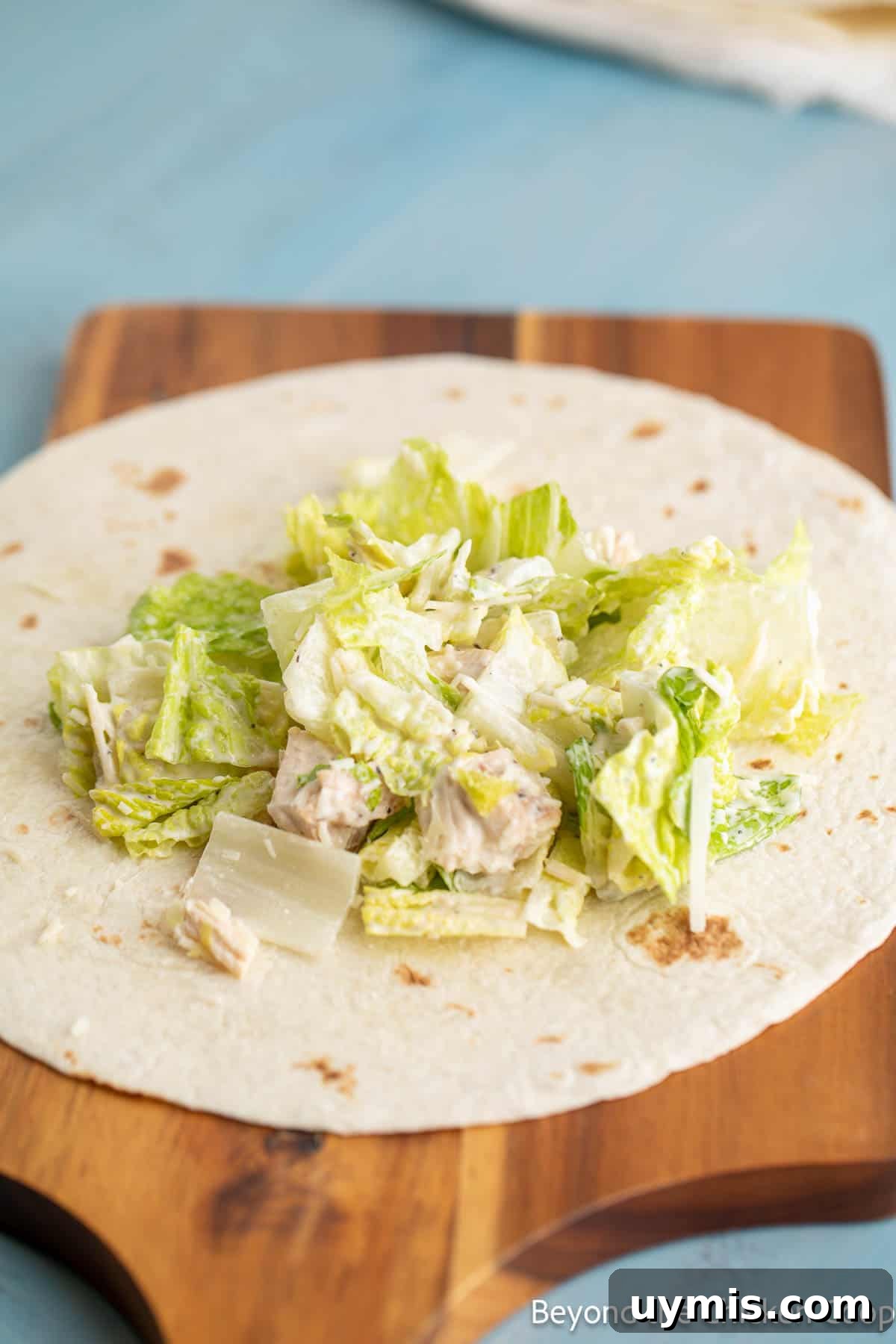 Chicken Caesar Wrap with Creamy Dressing 7 Caesar salad on a tortilla.