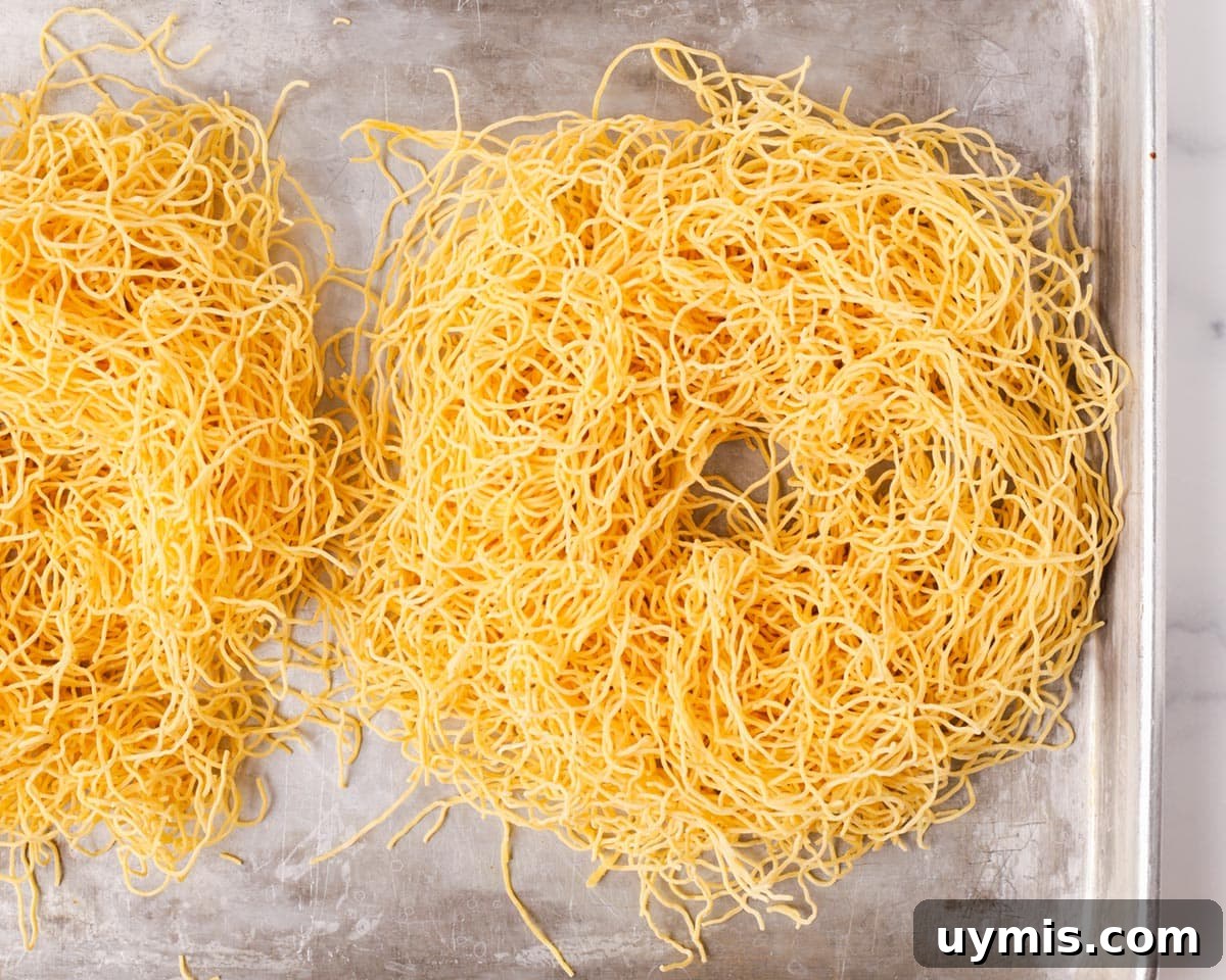 Vietnamese Crispy Noodle Stir Fry Mi Xao Gion 25 Making a nest shape with the noodles before frying.