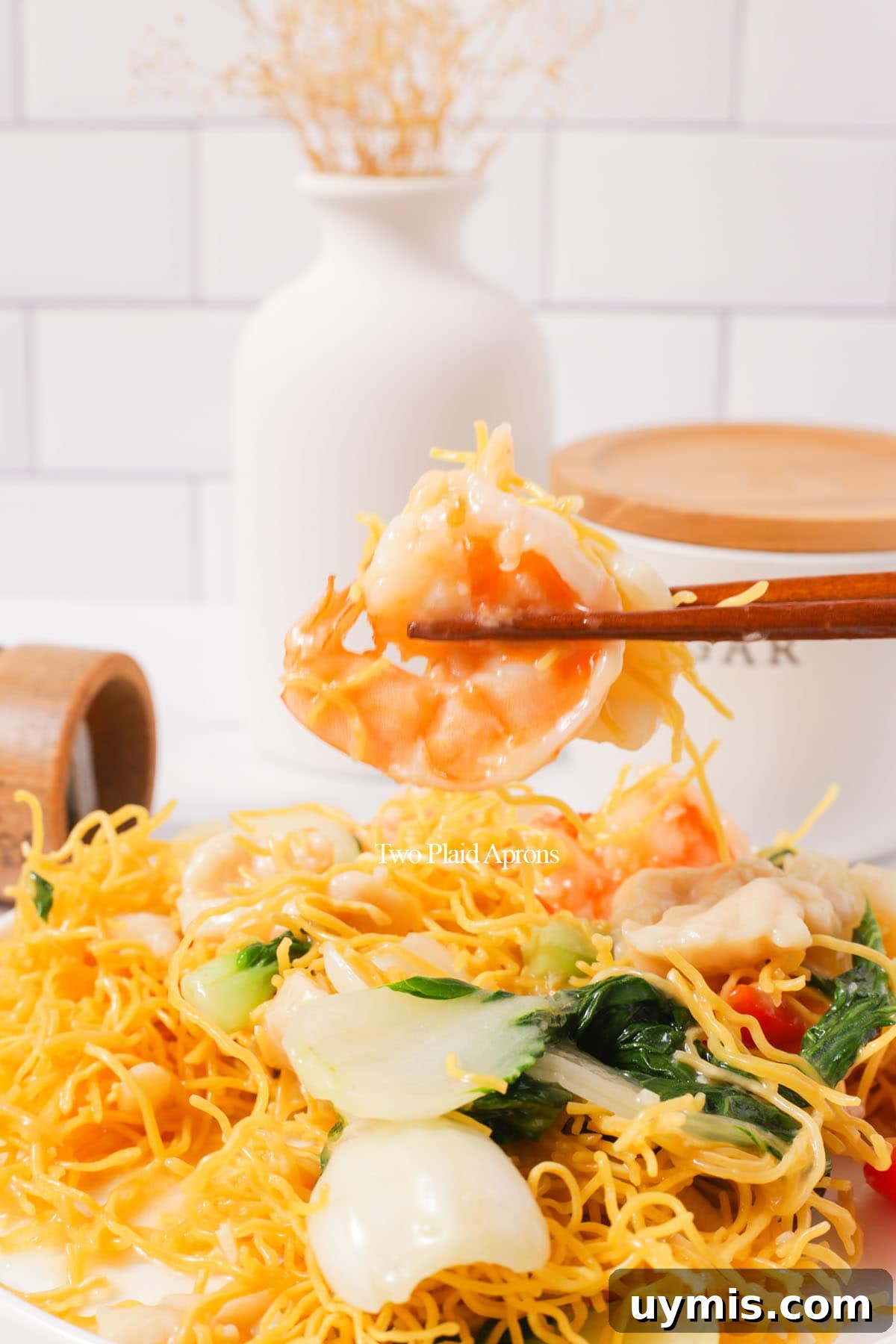 Vietnamese Crispy Noodle Stir Fry Mi Xao Gion 33 Holding shrimp from the mi xao gion.