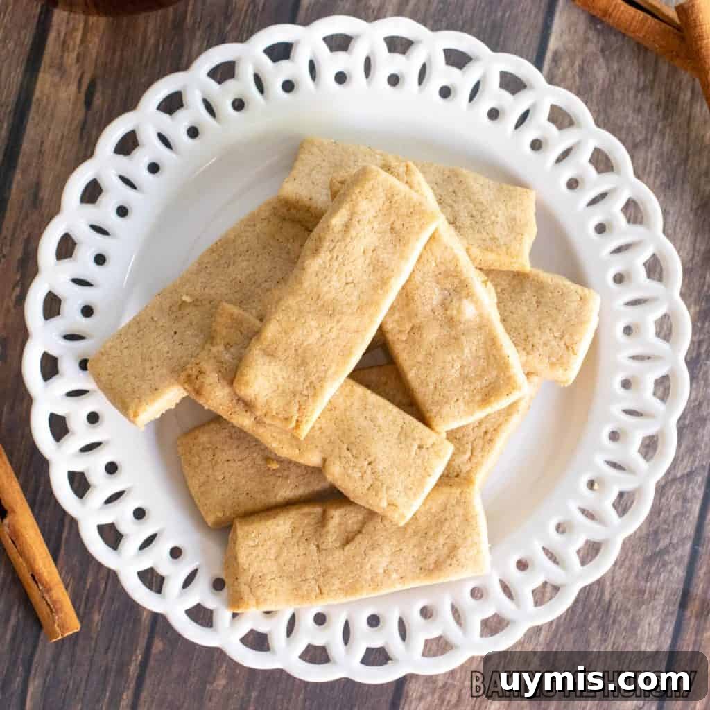 Cinnamon Shortbread Cookies Recipe 3 cinnamon shortbread cookies recipe piled on small decorative plate close up
