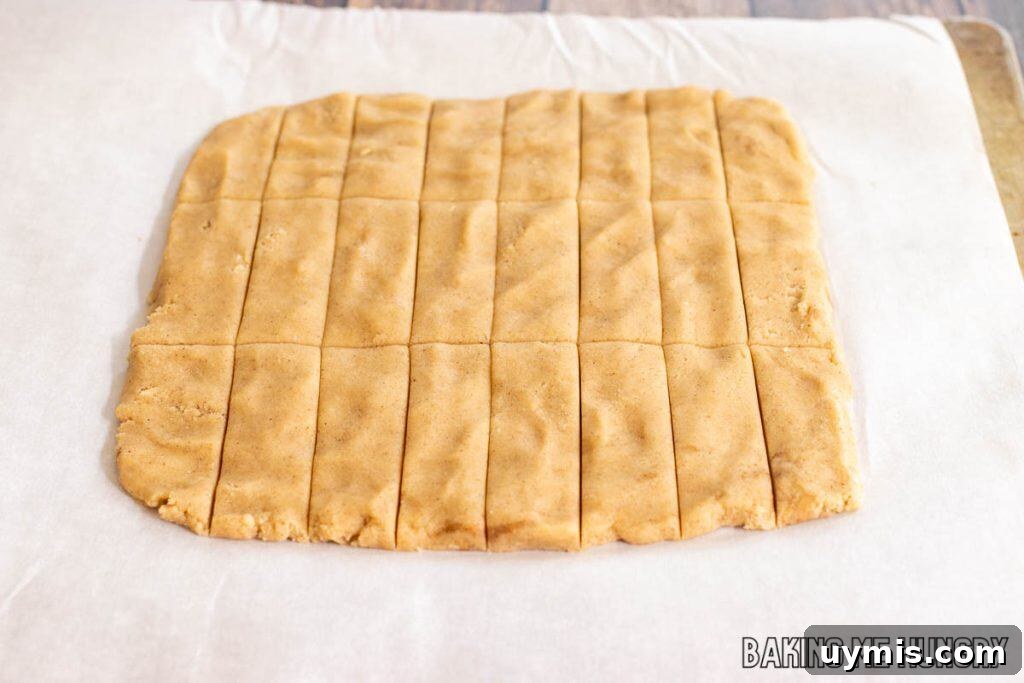 Cinnamon Shortbread Cookies Recipe 7 square of dough cut into rectangles on parchment