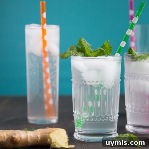 tall glasses of ginger ale with colorful straws