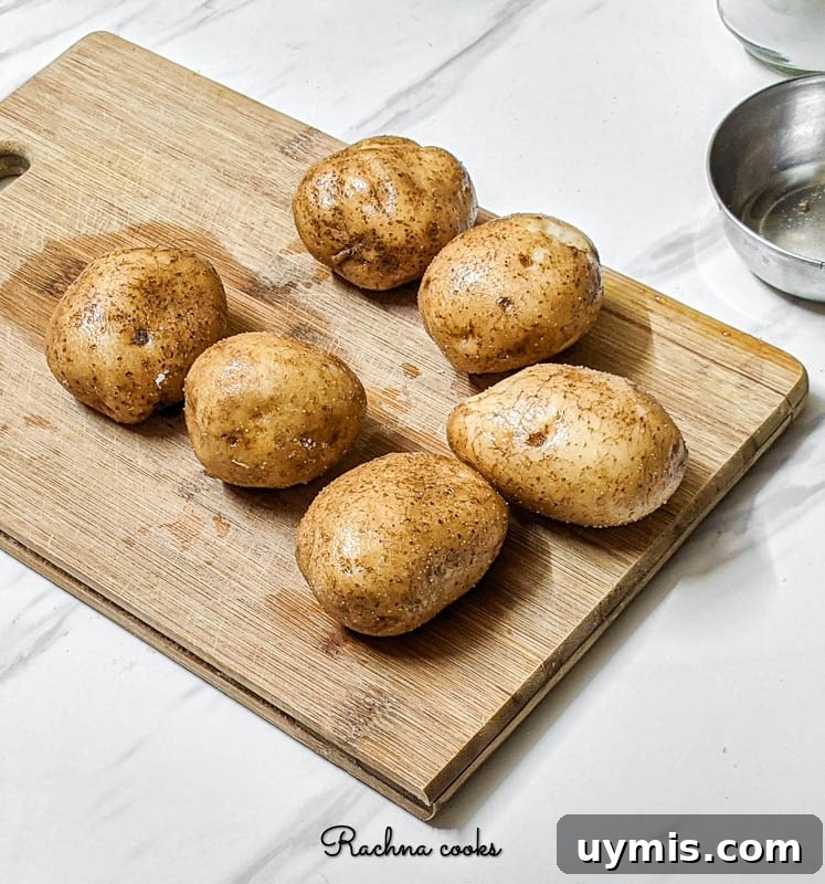 Crispy Air Fryer Baked Potatoes 3 Seasoned potatoes ready for the air fryer.