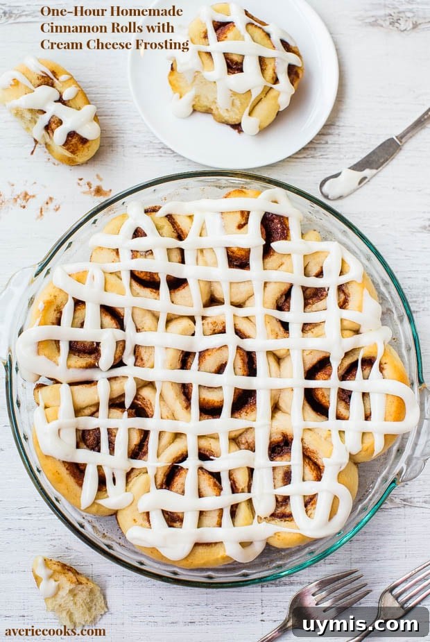 Pull-Apart Cinnamon Roll Monkey Bread Recipe 10 1-Hour Homemade Cinnamon Rolls with Cream Cheese Frosting in a pie dish.
