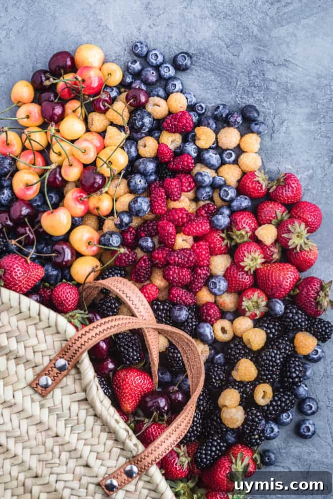 Summer Berry Galette with Fresh Seasonal Berries 3 Farmers market haul of fresh berries including strawberries, raspberries, blueberries, cherries, and blackberries.