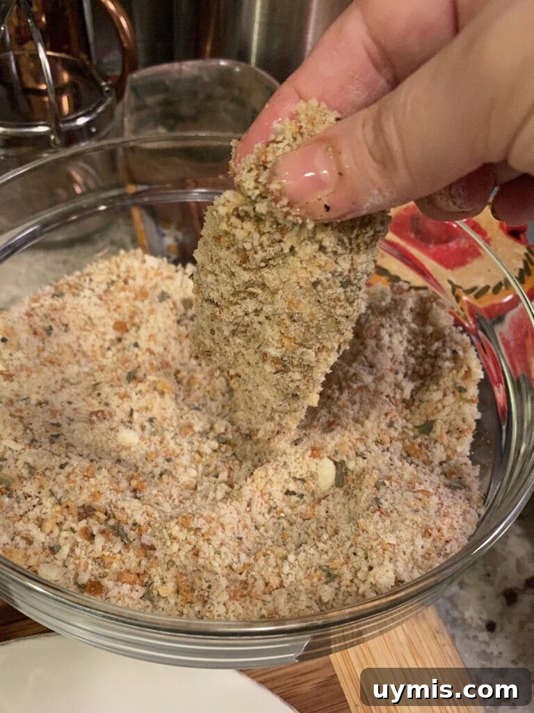 Italian Pan Fried Butterflied Shrimp Recipe 13 Coating the egg-dipped shrimp in the breadcrumb mixture.