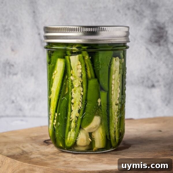 Jar of pickled serrano peppers.