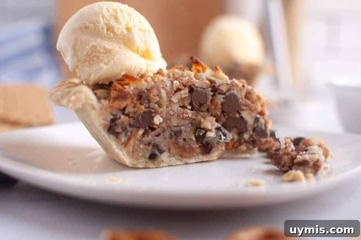 27 Chocolate Desserts You Can't Keep at Home 25 A slice of Texas Trash Pie topped with a scoop of vanilla ice cream, sits on a white plate.