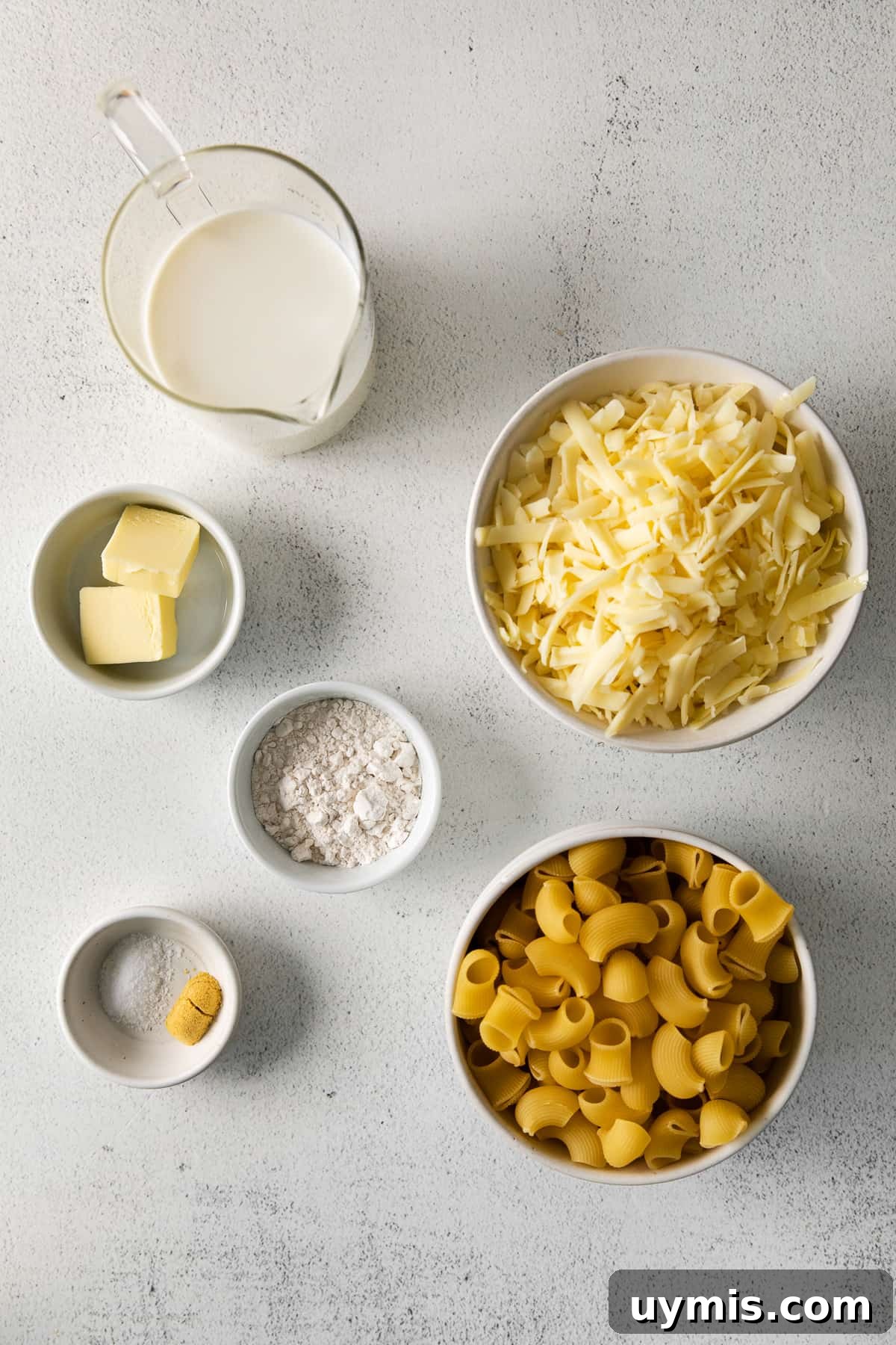 Ingredients for Copycat Panera Mac and Cheese Mac and cheese ingredients on a countertop.
