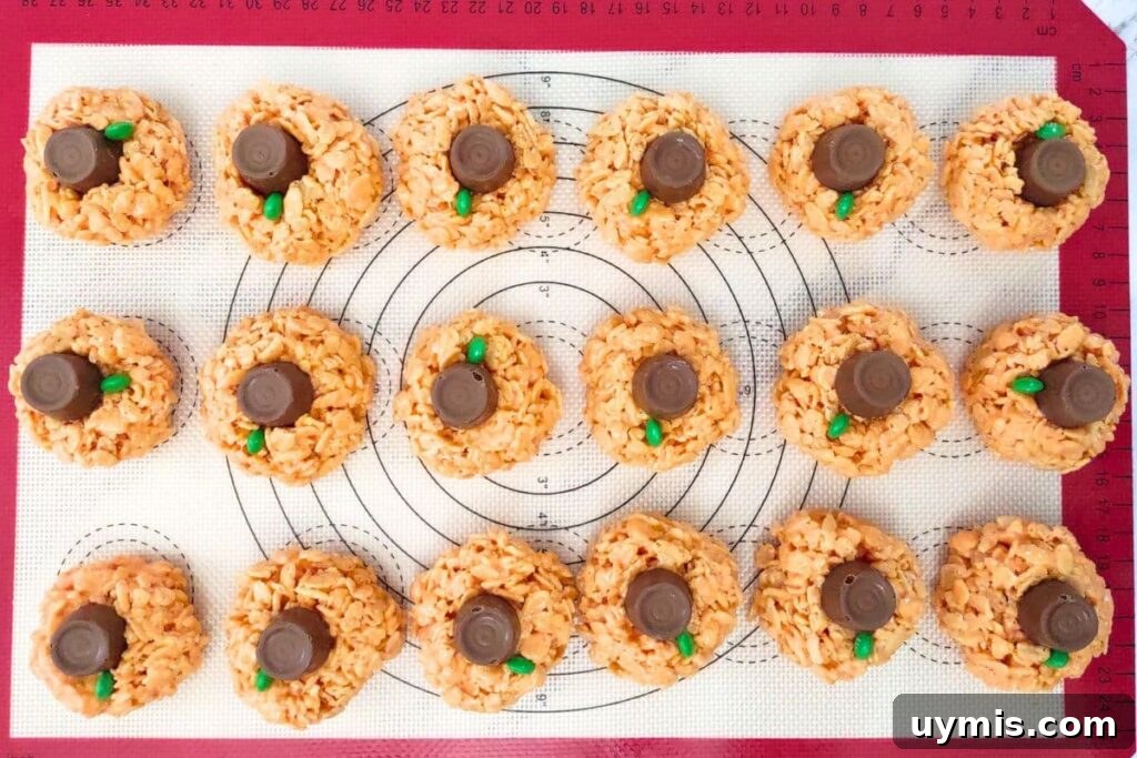 Fall Pumpkin Rice Krispie Treats with Rolos 10 place a rolo candy on top of each rice krispie ball