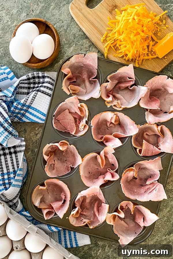 Make-Ahead Ham and Egg Breakfast Cups Recipe 3 the ingredients for ham and egg cups with cheddar cheese