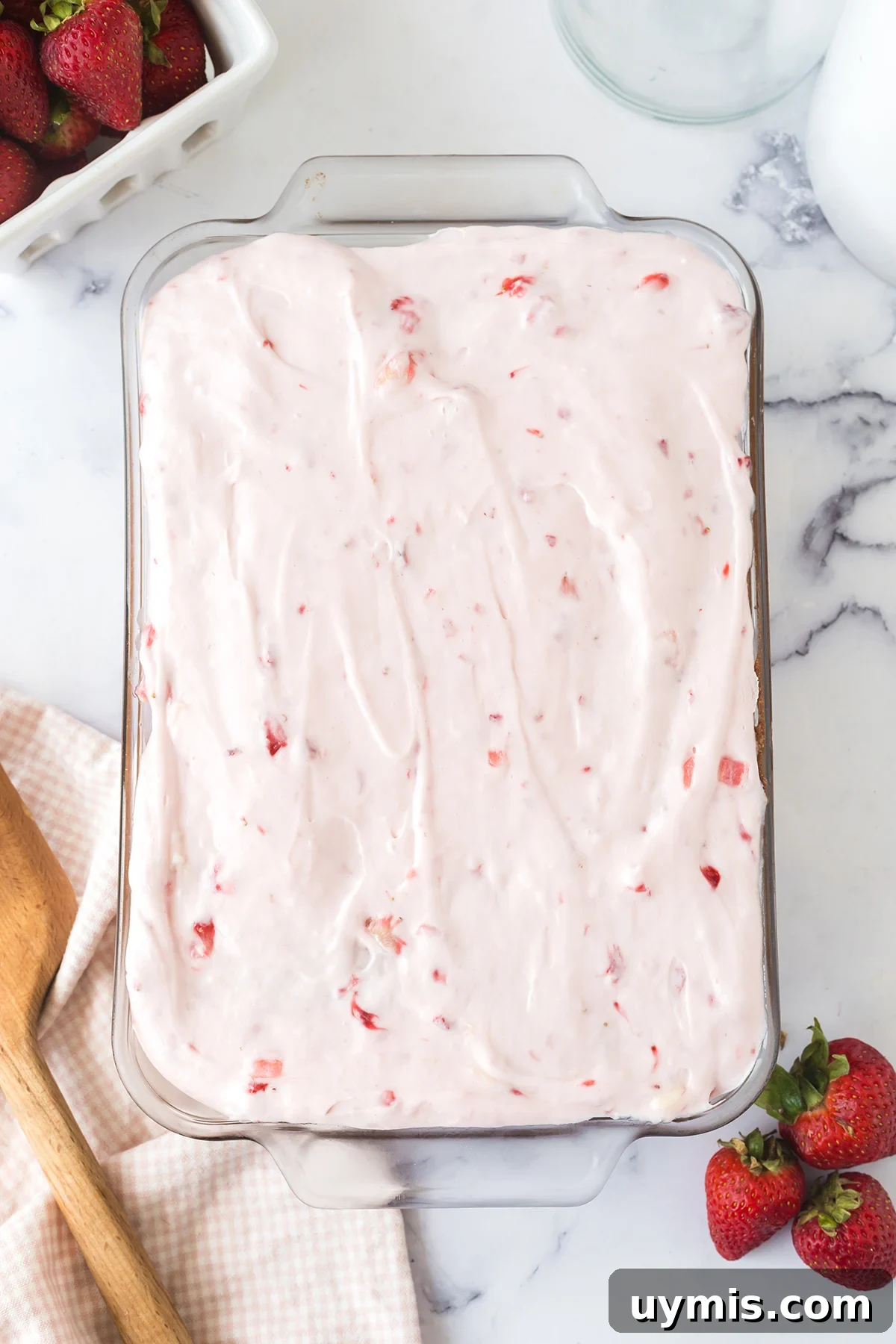 Moist Strawberry Sheet Cake with Cream Cheese Frosting 9 Strawberry Cake topped with Strawberry Cream Cheese Frosting in glass baking dish.