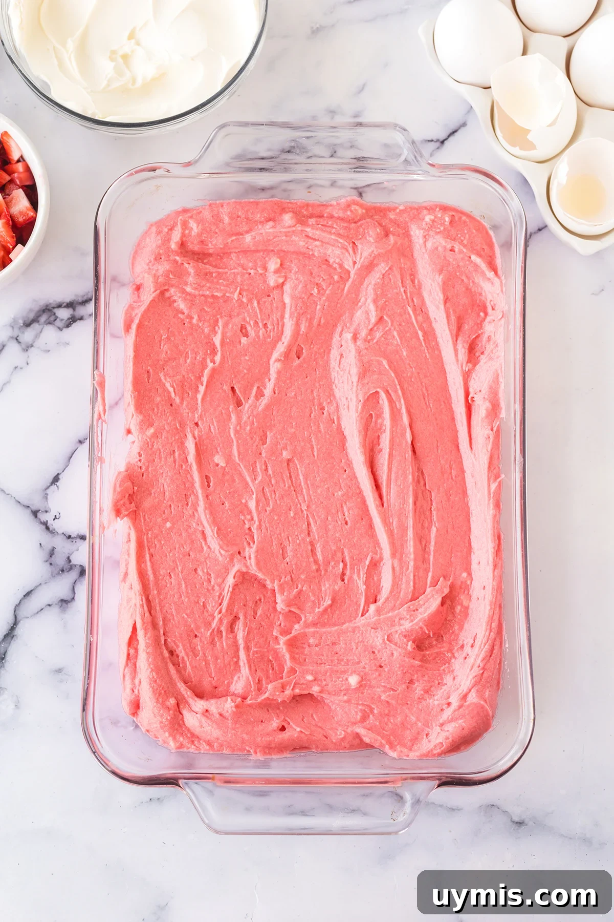 Moist Strawberry Sheet Cake with Cream Cheese Frosting 6 Strawberry cake batter in glass baking dish.