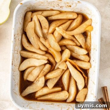 White rectangular dish of Baked Pears.