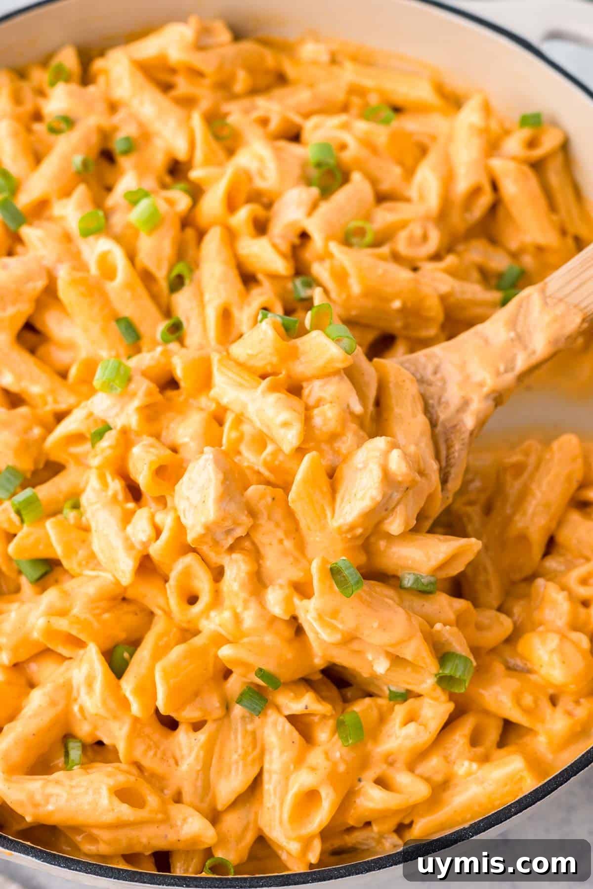 Buffalo Chicken Pasta garnished with green onions