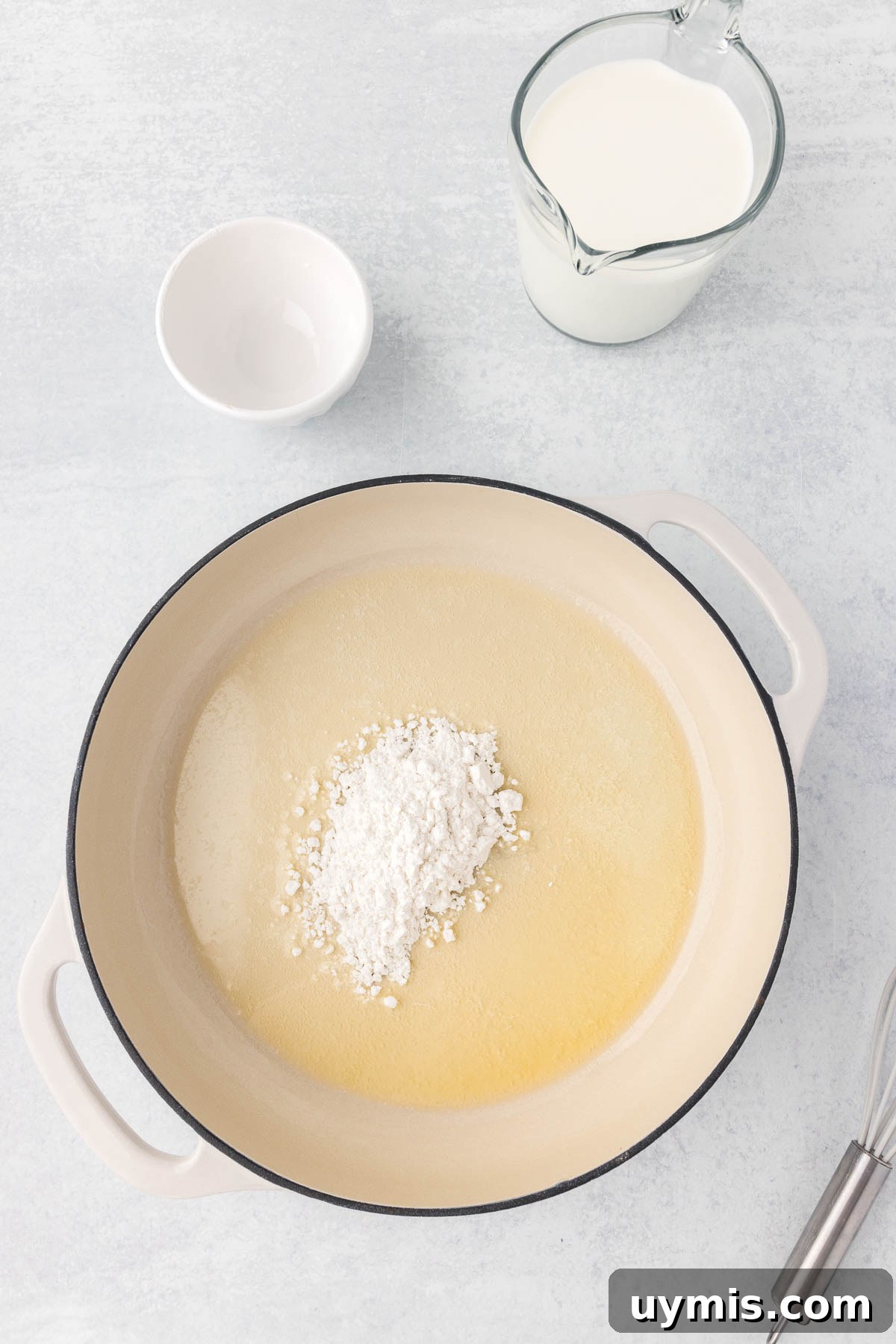Flour is added to the melted butter
