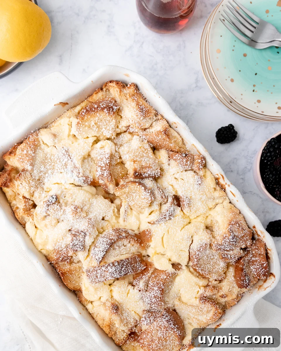Lemon Cheesecake French Toast Casserole Recipe 3 top view of the cheesecake french toast with berries and lemons at the edges of the picture