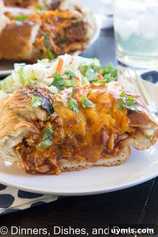 BBQ Chicken Stuffed French Bread Recipe 2 barbecue chicken stuffed french bread on a plate