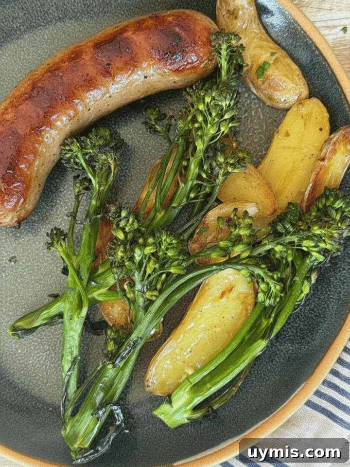 Sheet Pan Sausage and Potatoes Recipe 8 sheet pan sausage and potatoes with broccolini on a blue plate