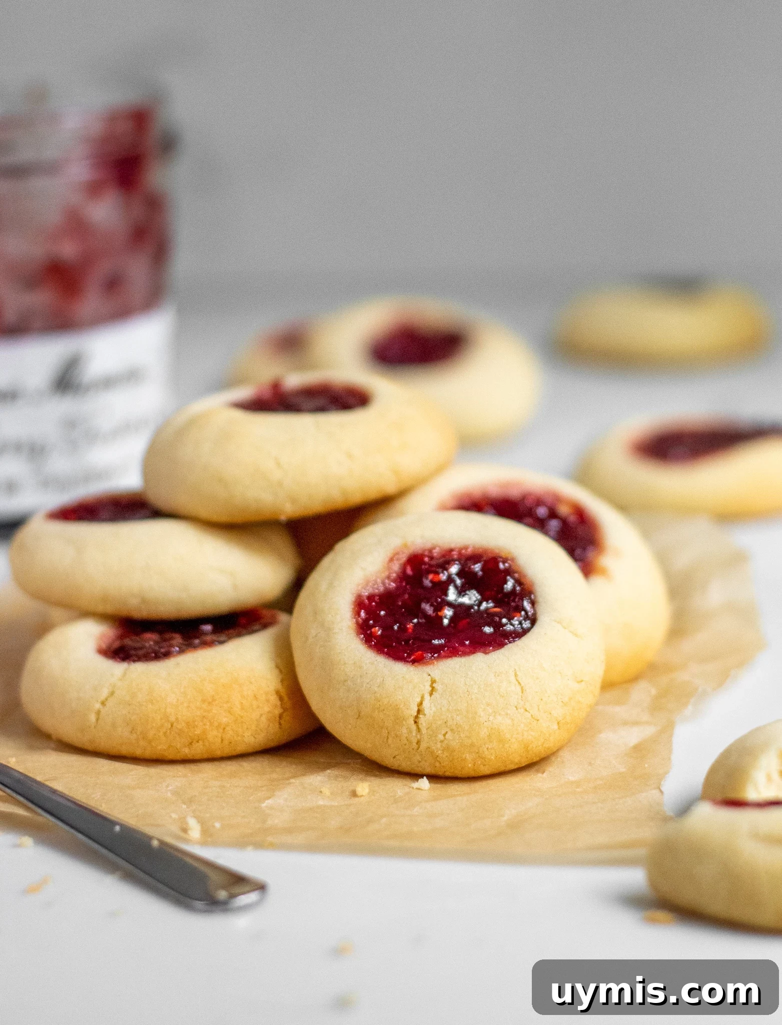 A stack of jam thumbprint cookies.