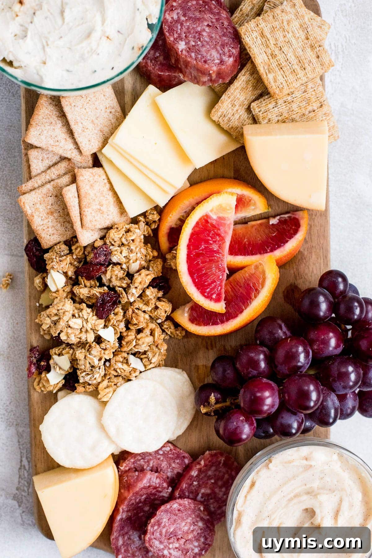 girls night cheeseboard with crackers cheese fruit and meats
