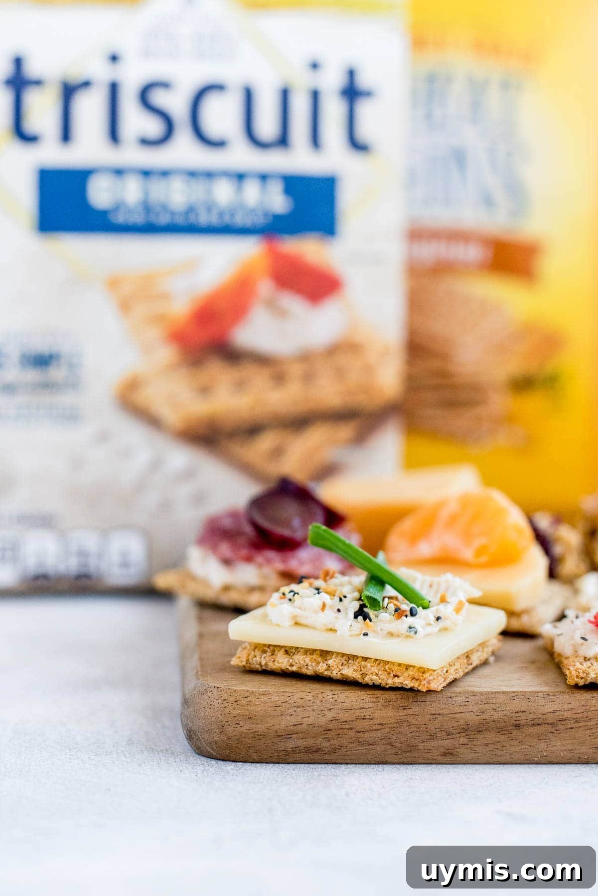 crackers and toppings on cheeseboard
