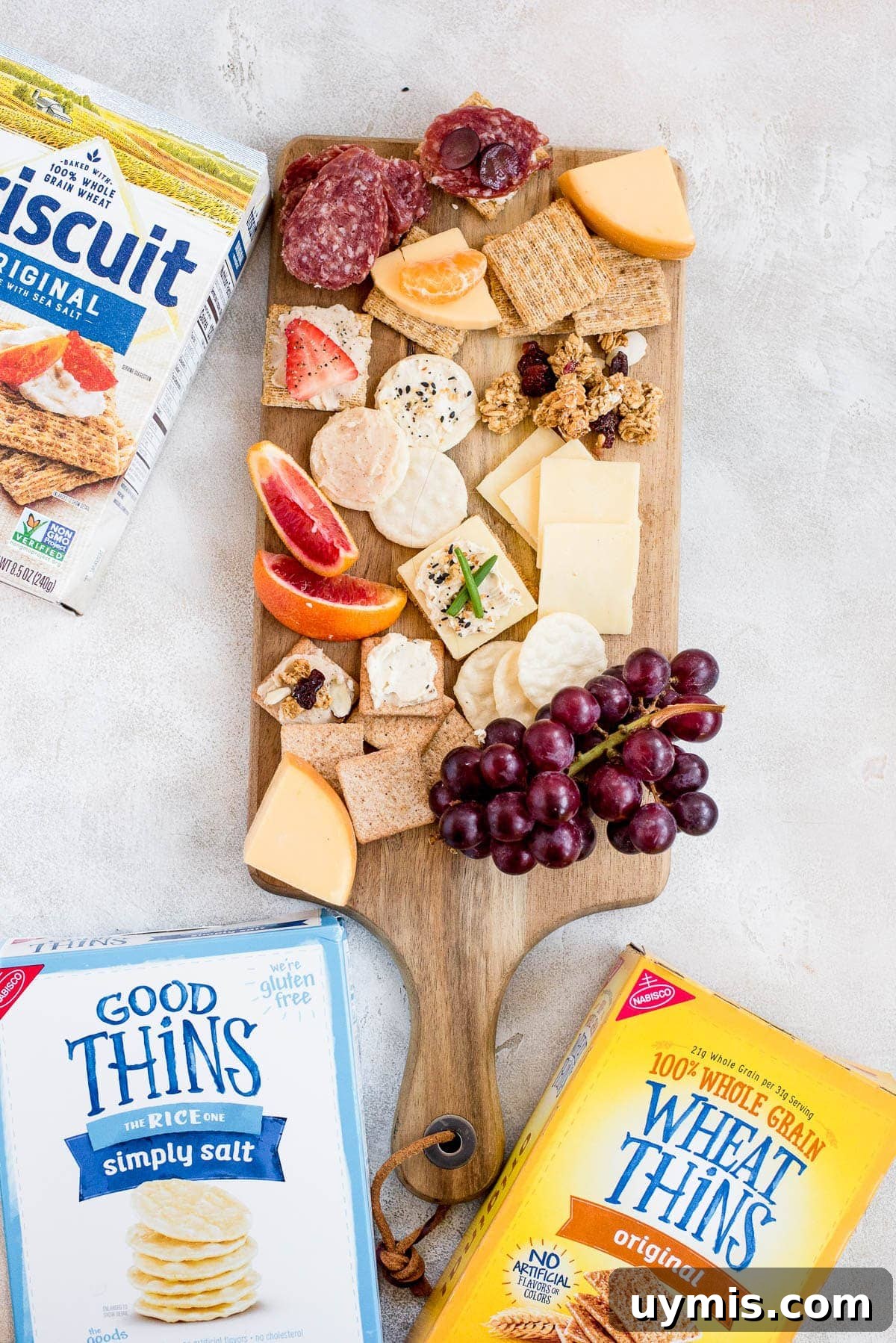 cured meat cheese and crackers on cheeseboard