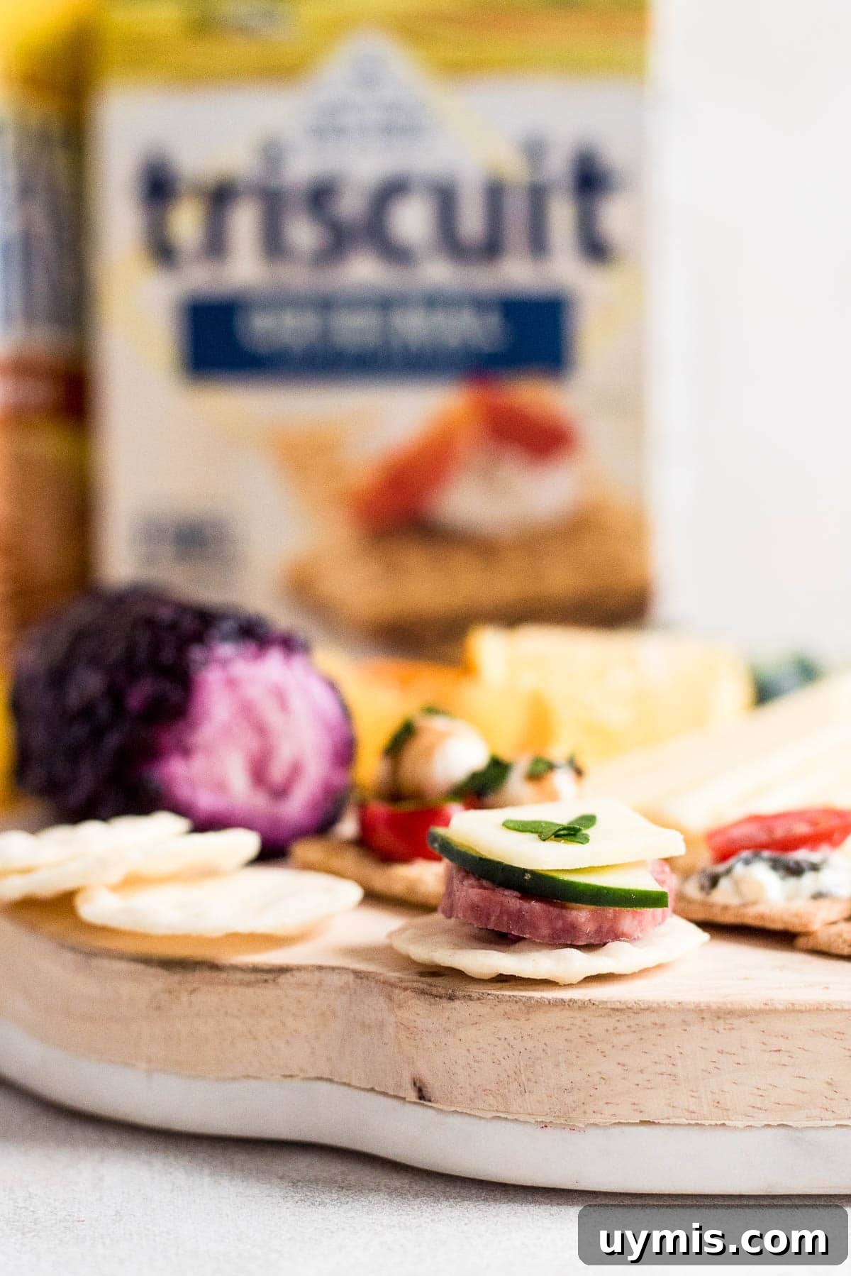 assembled girls night cheeseboard with crackers and toppings