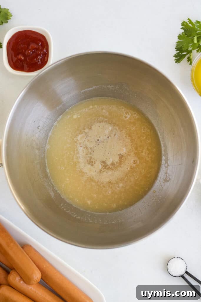 Pretzel Dogs Recipe: Soft Pretzel-Wrapped Hot Dogs 3 Pretzel dough yeast mixture foaming