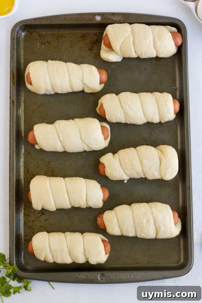 Pretzel Dogs Recipe: Soft Pretzel-Wrapped Hot Dogs 6 Pretzel dogs ready for boiling