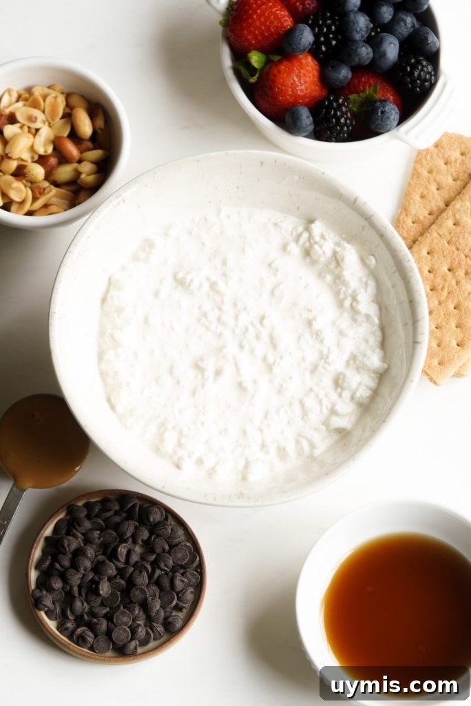 Viral High Protein Frozen Cottage Cheese Bark 4 cottage cheese, pure maple syrup, and toppings measured out on a white table