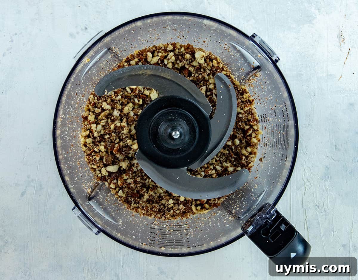 Layered Mixed Berry Parfaits with Greek Yogurt and Granola 4 Ground nuts and cinnamon in a food chopper.