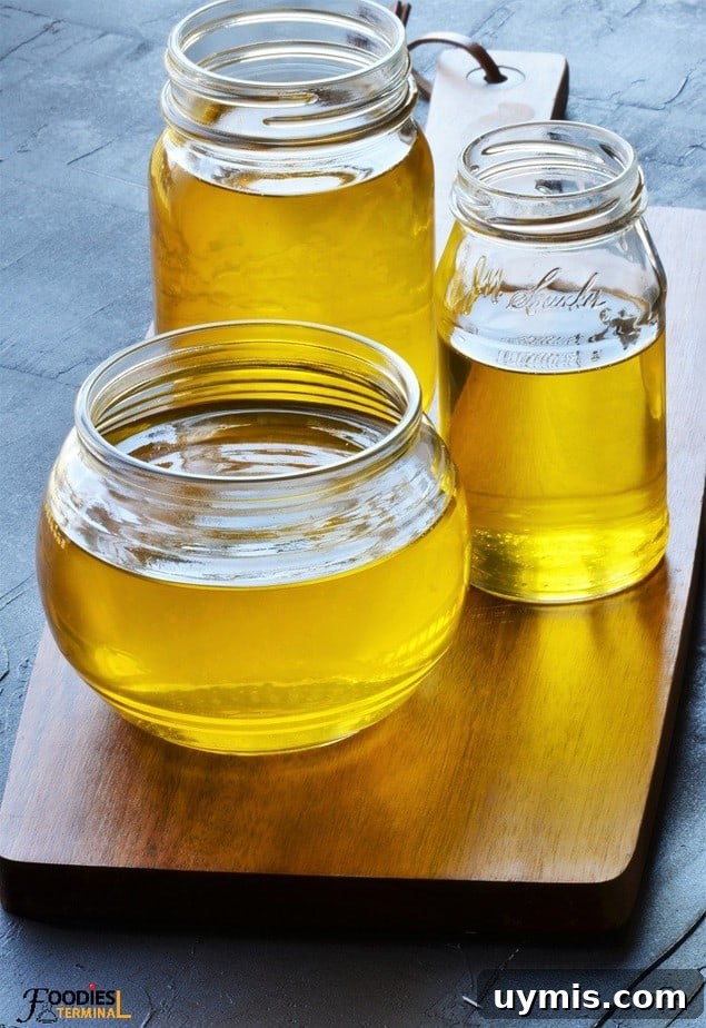 Instant Pot Ghee Recipe: Homemade Clarified Butter 2 Instant pot ghee in three glass jars on a wood base