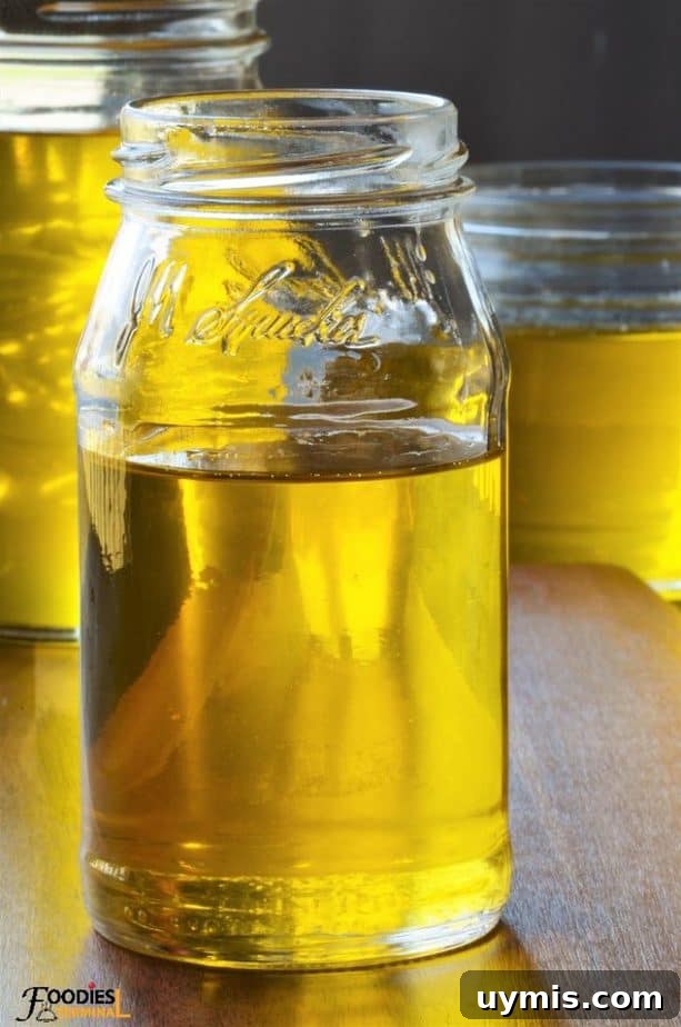 Instant Pot Ghee Recipe: Homemade Clarified Butter 13 golden ghee in liquid state in a glass jar