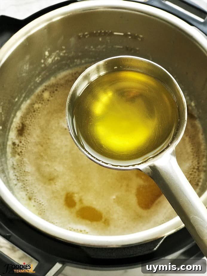 Instant Pot Ghee Recipe: Homemade Clarified Butter 6 homemade ghee in instant pot picked up in a ladle