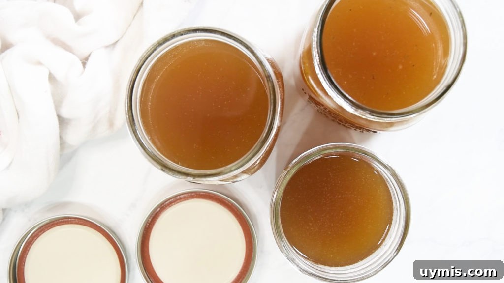 How to Make Instant Pot Turkey Stock 9 Three mason jars holding homemade stock