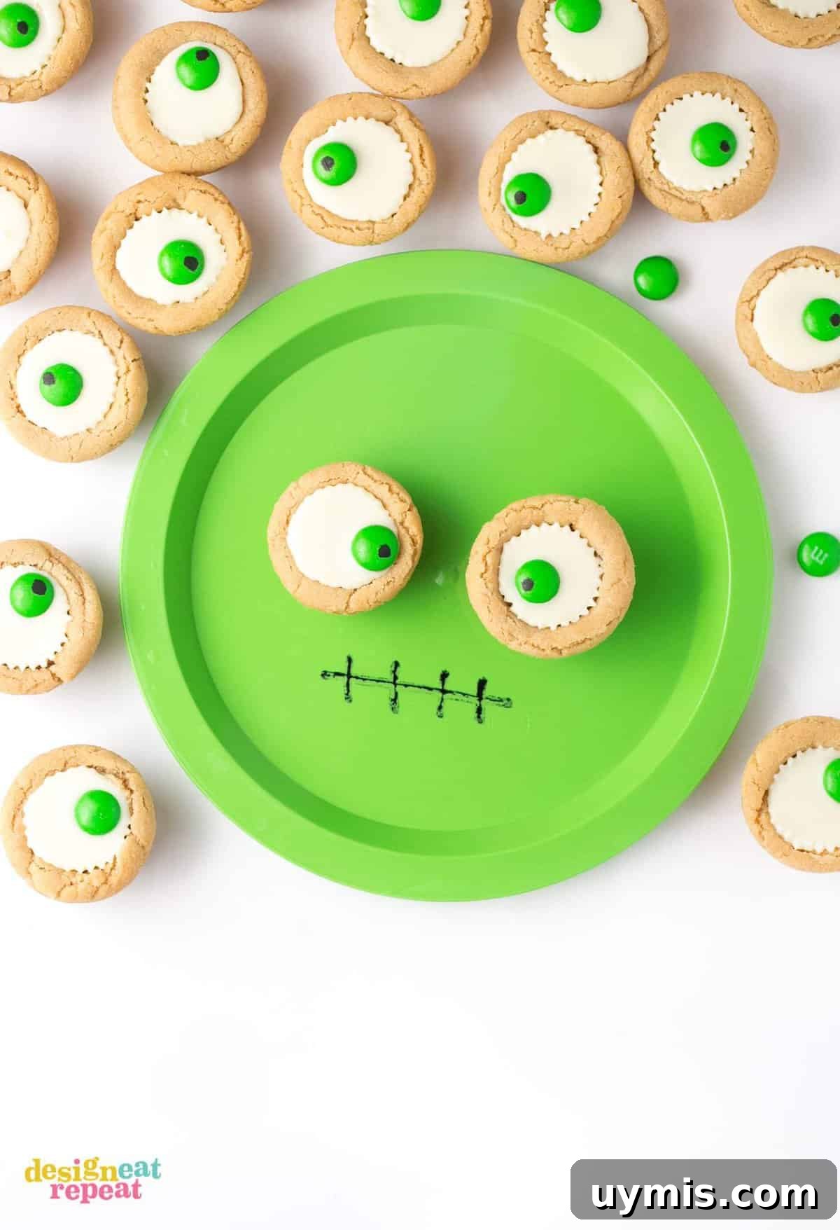 Halloween Eyeball Cookies with Peanut Butter Cups 3 Mini white peanut butter cup cookies on green monster face plate.