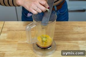 Grating the garlic into the blender