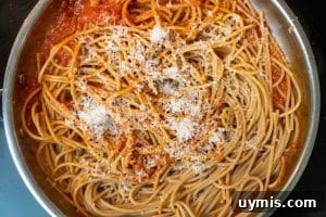 Stirring in the spaghetti & cheese