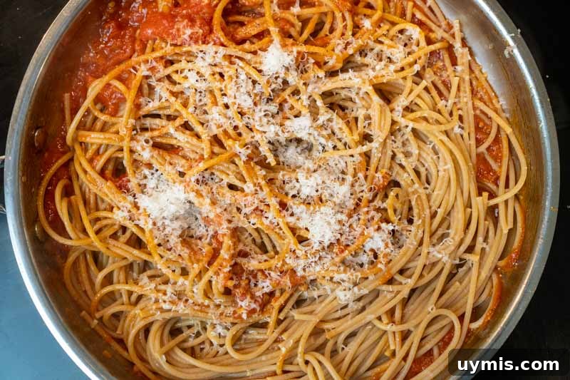 Stirring in the spaghetti & cheese