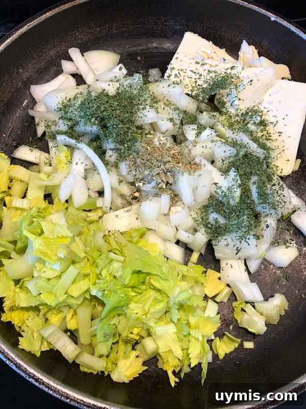 Traditional Bread Stuffing Recipe 5 celery, onion, butter, herbs in pan ready to saute
