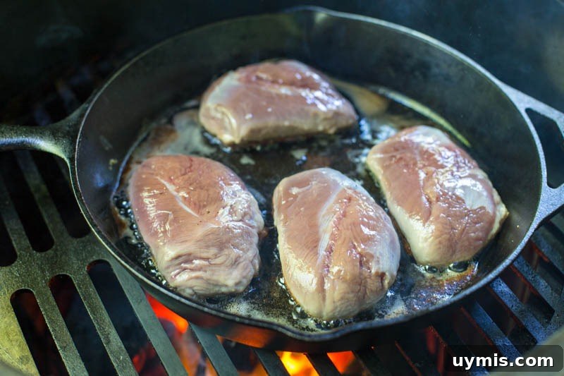 Big Green Egg Duck Breast with Crispy Seared Skin 7 Crispy duck breast skin in cast iron skillet