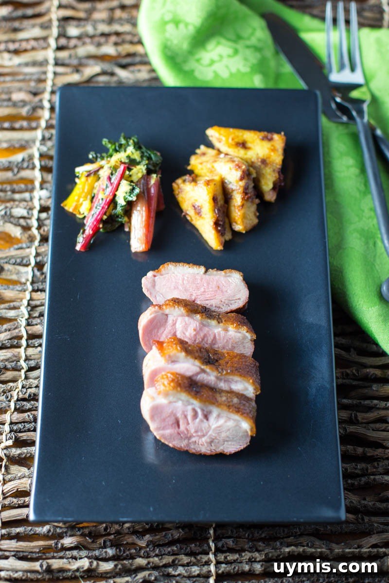 Big Green Egg Duck Breast with Crispy Seared Skin 10 Sliced seared duck breast with cherry port sauce
