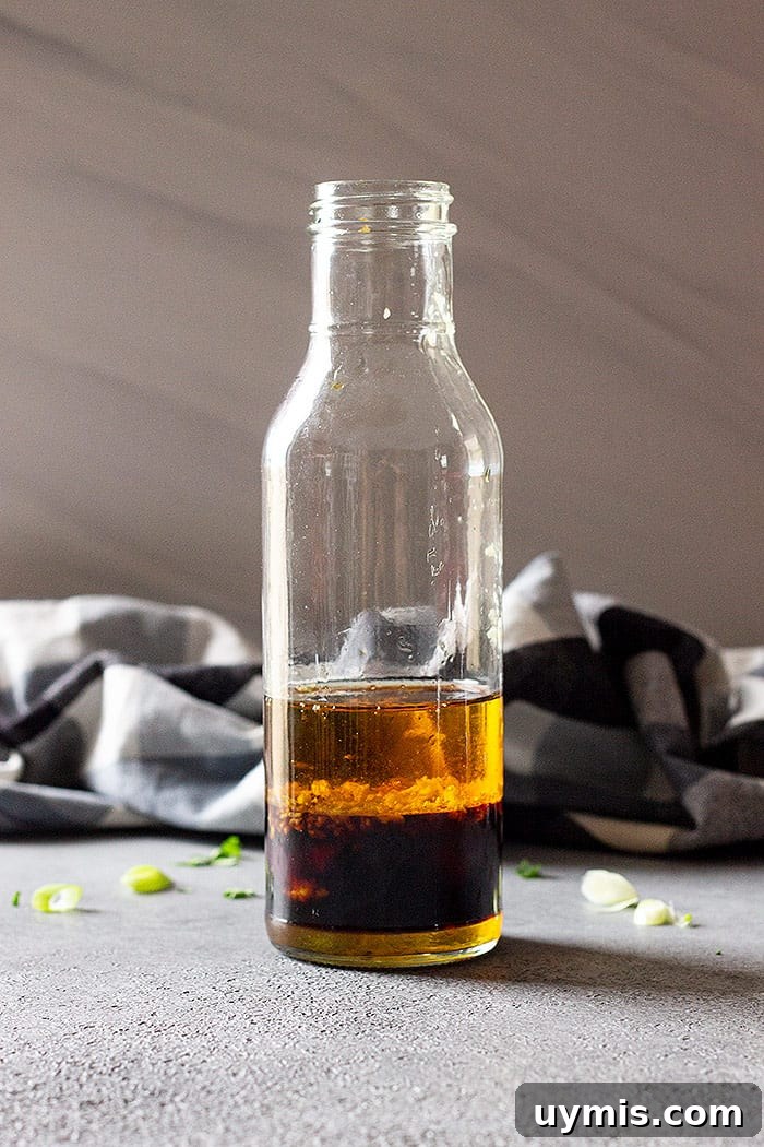 Classic Asian Salad Dressing with Sesame and Soy 4 adding ingredients to a bottle to shake.