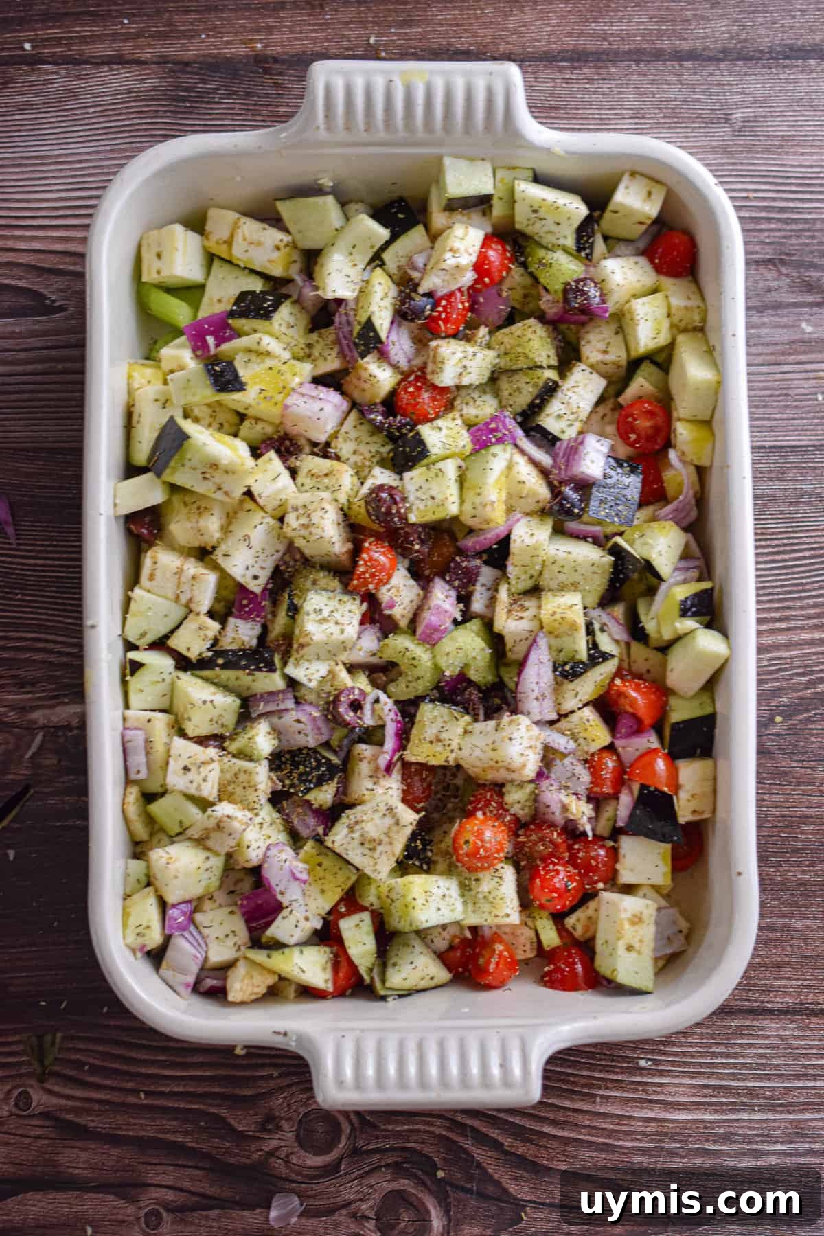 Creamy Greek Baked Pasta with Feta 5 The tomatoes and olive oil are added to the dish.